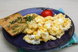 Scrambled eggs with tomato photo