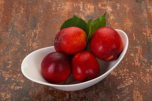 Sweet tasty ripe few nectarines photo