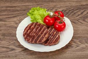 Grilled burger cutlet with sauce photo