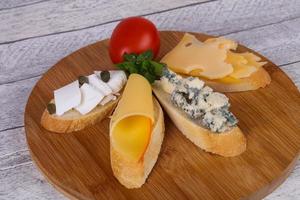 Bruschetta with various cheeses photo