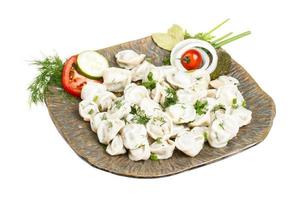 Bowl with traditional russian dish - pelmeni photo