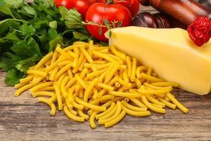 Italian pasta raw Maccheroni for cooking photo