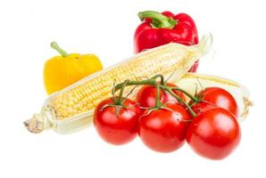 pepper, ripe yellow corn and tomato photo