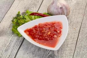 Spicy tomato and garlic sauce photo