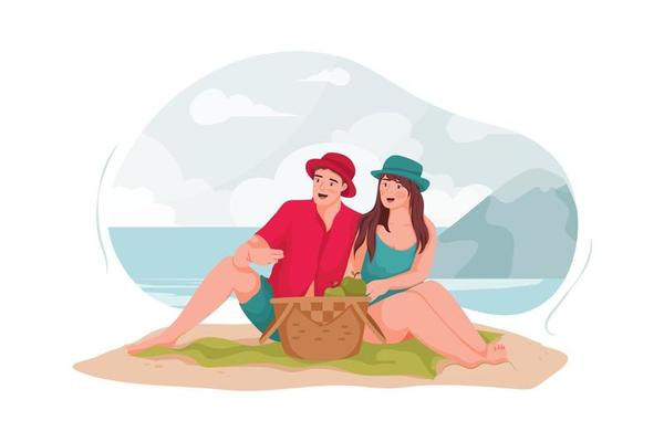 Young couple having a picnic on the beach.