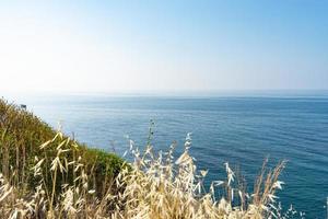 The coast and beaches of Turkey Alanya. Landscape of the seashore from a height. Vacation on the beach in Turkey photo