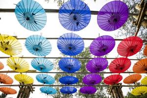 Colorful umbrellas in the park. photo