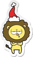 sticker cartoon of a tired lion wearing santa hat vector