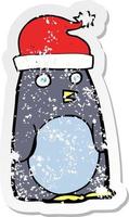 retro distressed sticker of a cartoon christmas penguin vector