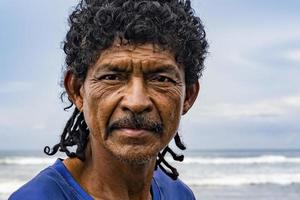 Close-up of a native fisherman on the shore. photo