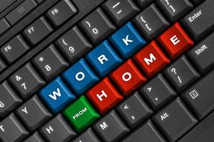 Work from home word on black keyboard, using computer online at home office photo