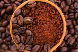 Roasted coffee beans and powder background photo