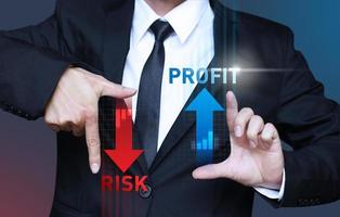 Businessman show increase profit and decrease risk of investment photo