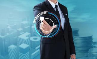 Business man touch rotate compass to investment, management concept photo