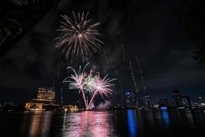 fireworks on the river in the dark sky photo