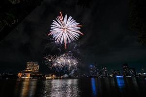 fireworks on the river in the dark sky photo