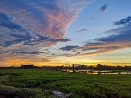 beautiful clouds over the rice field photo