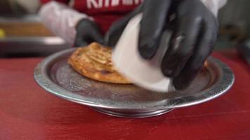 Cooked rice pilaf.  The chef puts the rice pilaf on the plate. video