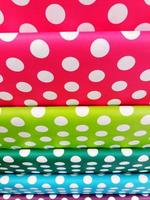 Many colorful of paper for wrapping the gift. Pattern or detail of circle with different color paper photo