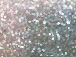 Glitter light. White and silver bokeh light abstract background. photo