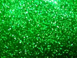 Glitter light. Small Green and white bokeh light abstract background. photo