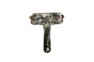 Black dirty paint roller be stained color on isolated white background. Artist's paint roller photo