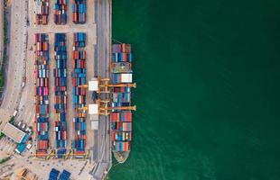 Aerial view from drone Logistics and transportation of Container Cargo ship and Cargo import export , Business logistics concept, photo