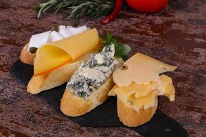 Bruschetta with various cheeses photo