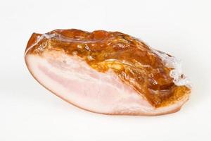 Smoked pork meat over white background photo