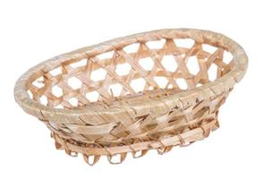 Wickerwork empty yellow breadbasket on white background photo