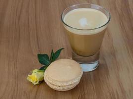 Coffee with macaroons and rose photo