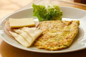 Omelet with cheese and salad photo