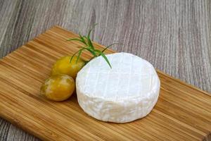 Whole brie cheese photo