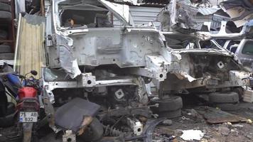 Scrapped cars, crashed cars. Scrap cars are used for recycling and second-hand spare parts. Pile of scrap vehicles. video