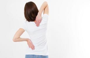 Woman back pain - female rheumatism and its treatment Attractive female person suffers from backache. All on white background. photo