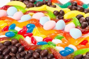 Colorful candy, lollipop and sweets isolated on white background. Top view. Selective focus. photo