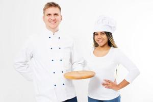 Two smiling chefs hold empty pizza desk isolated on white background photo