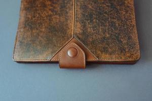 leather notebook on grey background photo