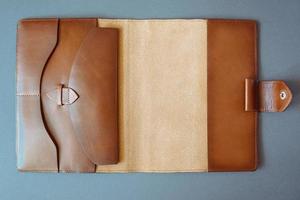 leather handmade notebook on dark wooden background photo