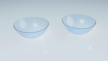 Couple of contact lens on clean reflection floor in laboratory. Optics medical and healthcare concept. Rotating camera motion around objects. Full HD footage motion graphic video