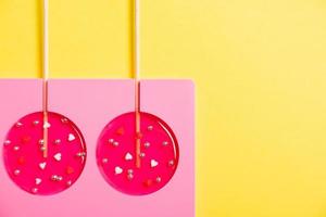 lollipops on a stick in a single form for cooking on a yellow background. photo