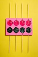 lollipops on a stick in a single form for cooking on a yellow background. photo