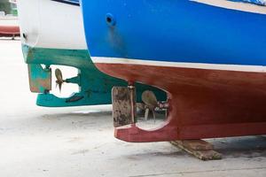 Two colorful fishing boats out of the water. Tazones, Asturias photo