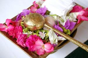 Traditional Javanese custom, Flowers in a brass bowl for the procession of the bride and groom photo