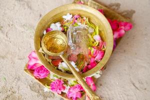 Traditional Javanese custom, Flowers in a brass bowl for the procession of the bride and groom photo