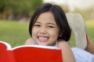 Asian girl reading book photo