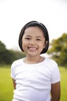 Asian girl relax and smiling happily in the park photo