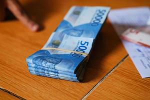 Rupiah banknotes on the table. Indonesian banknotes photo