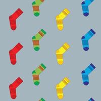 Pattern of vector colorful socks on a gray background