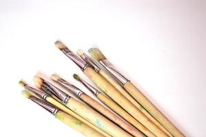 Brushes of different sizes on a white background. Classic flat brushes made of natural bristles for painting on canvas and paper. Free space for text. photo